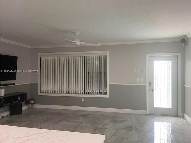 living room with ceiling fan and ornamental molding