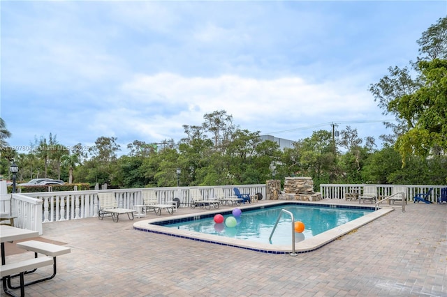 community pool featuring a patio area