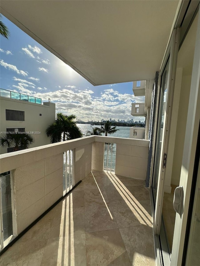 balcony featuring a water view