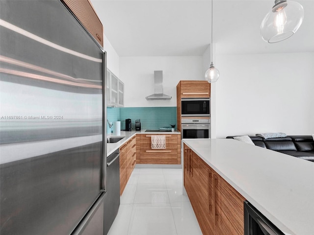 kitchen featuring wall chimney exhaust hood, pendant lighting, decorative backsplash, light tile patterned flooring, and black appliances