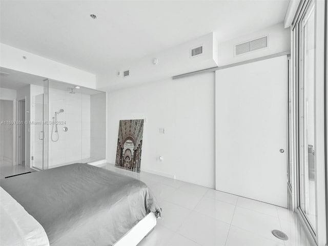 bedroom with light tile patterned floors