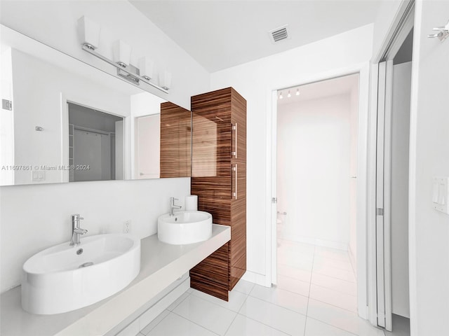 bathroom featuring tile patterned floors and vanity