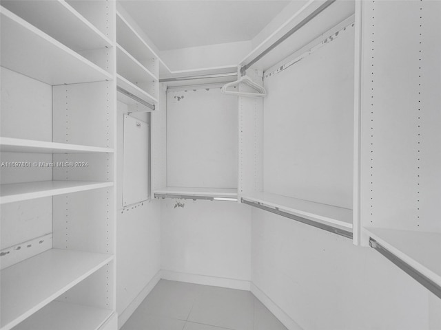 walk in closet featuring light tile patterned floors