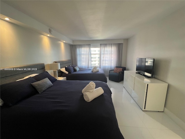 bedroom with light tile patterned floors