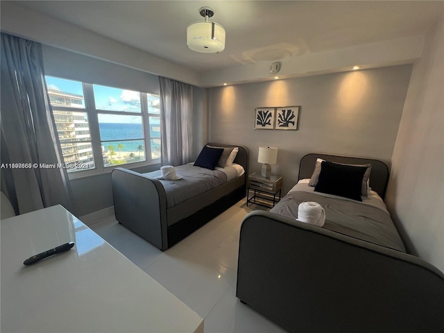 tiled bedroom with a water view