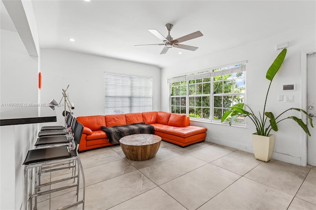 tiled living room featuring ceiling fan