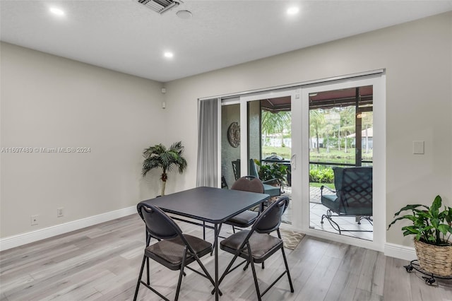 dining space featuring light wood-type flooring