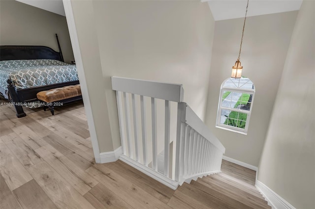 stairway with wood-type flooring