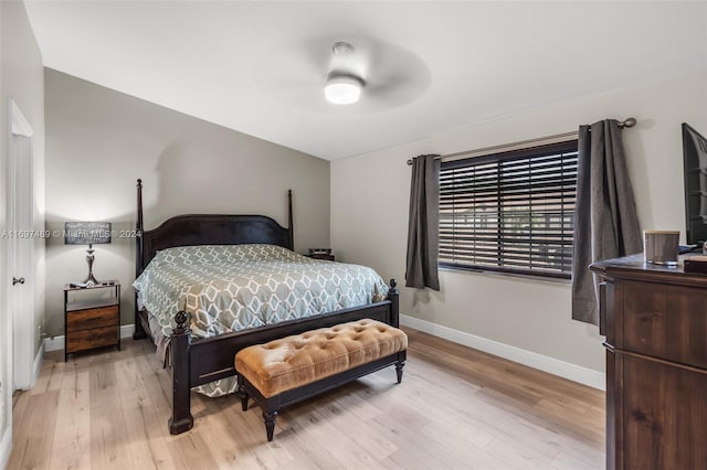 bedroom with ceiling fan and light hardwood / wood-style flooring