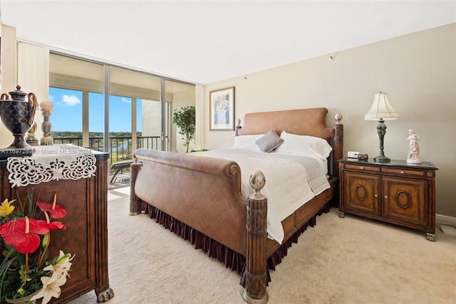 carpeted bedroom featuring access to outside