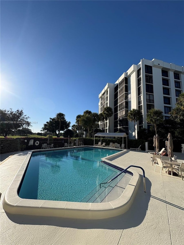 view of swimming pool featuring a patio