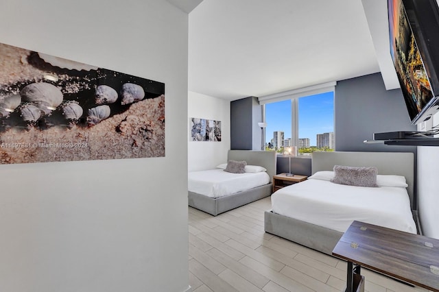 bedroom featuring a wall of windows