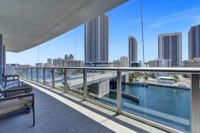 balcony featuring a water view