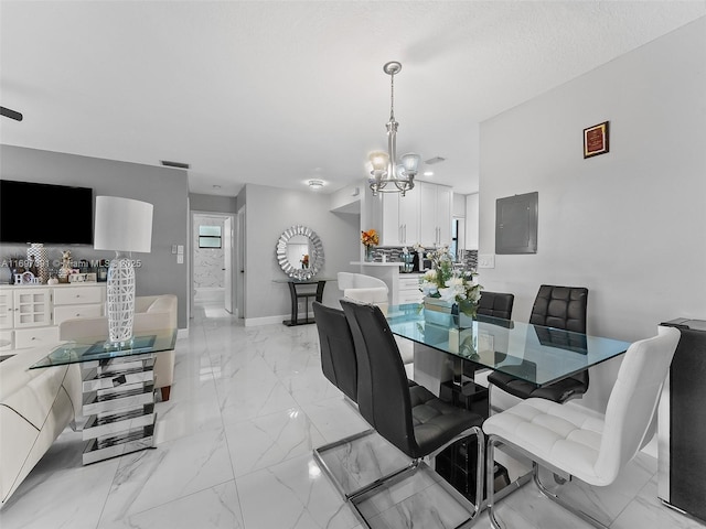 dining area with a notable chandelier, marble finish floor, baseboards, visible vents, and electric panel