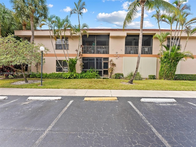 view of property with uncovered parking