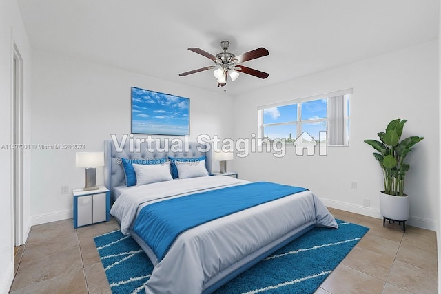 bedroom featuring ceiling fan and tile patterned flooring