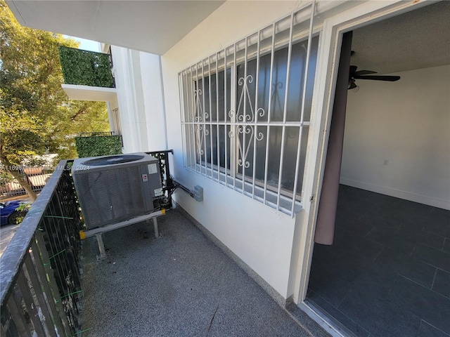 balcony featuring a ceiling fan and central AC