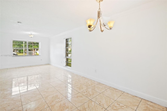 unfurnished room with a chandelier, light tile patterned floors, and ornamental molding