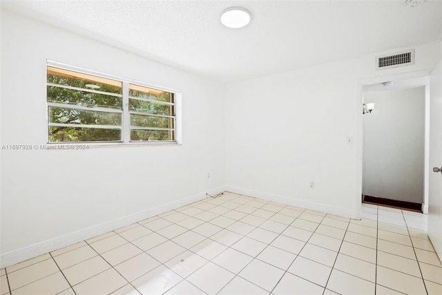 view of tiled spare room