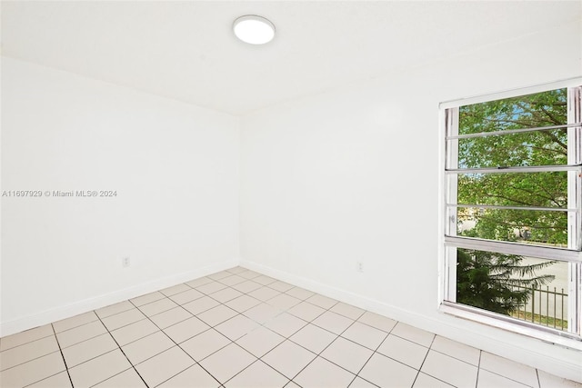 empty room with light tile patterned flooring