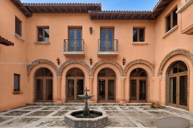 back of house featuring french doors