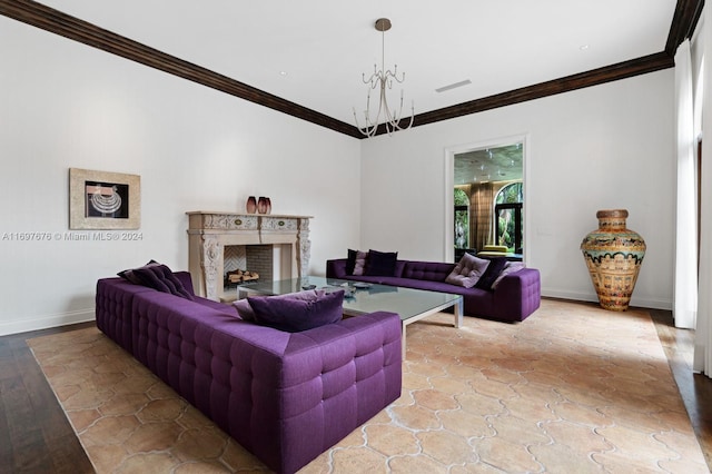 living room featuring light hardwood / wood-style floors, ornamental molding, and an inviting chandelier