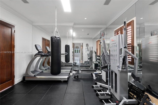 exercise room featuring ornamental molding