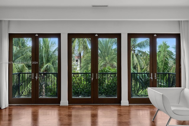 doorway to outside with french doors and hardwood / wood-style floors