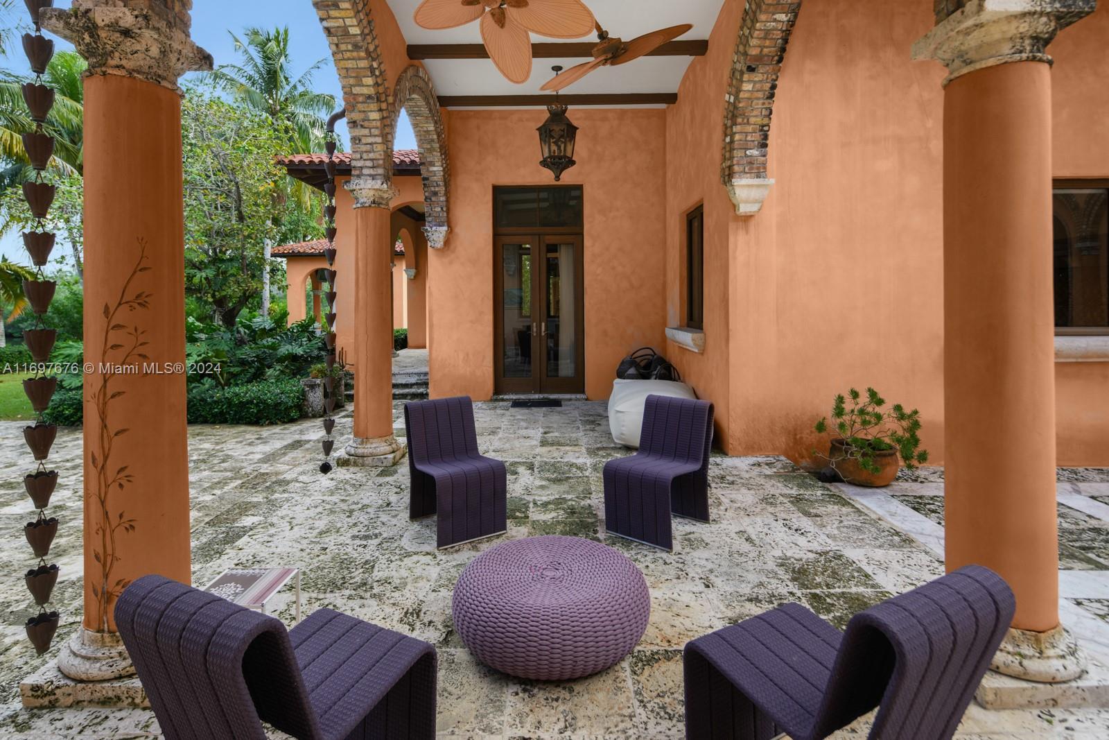 view of patio featuring ceiling fan and french doors