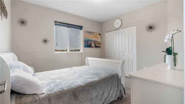 carpeted bedroom with a closet