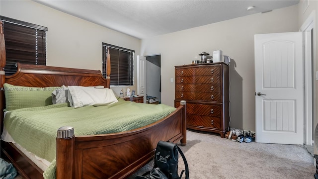 carpeted bedroom with a textured ceiling