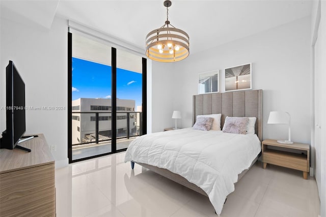 bedroom with access to exterior, tile patterned flooring, an inviting chandelier, and expansive windows