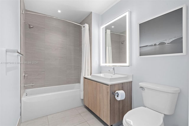 full bathroom featuring tile patterned floors, vanity, toilet, and shower / tub combo with curtain