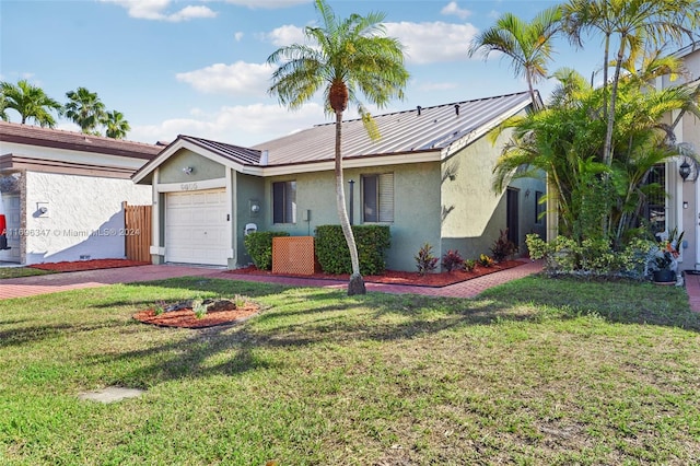 ranch-style home with a front yard and a garage