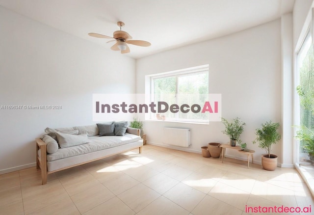 living area with radiator, ceiling fan, and light tile patterned flooring