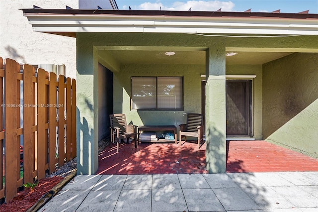 entrance to property with a patio area