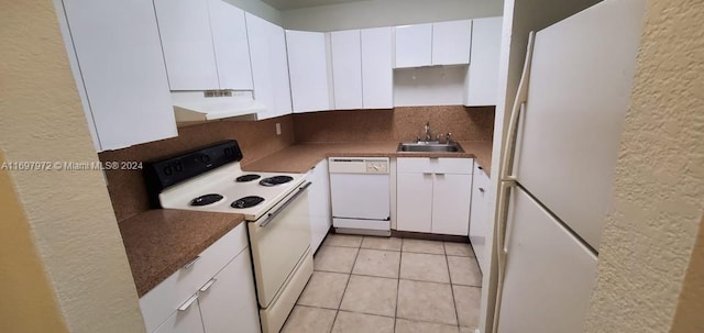 kitchen featuring sink, white cabinets, and white appliances