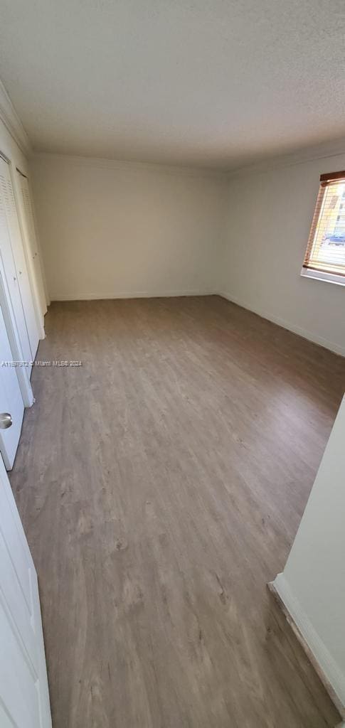 empty room with wood-type flooring