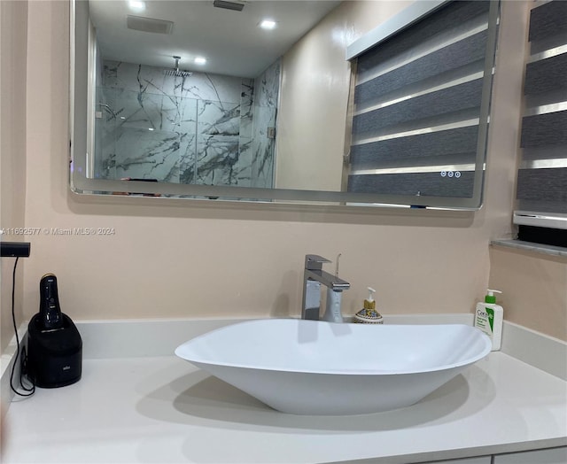 bathroom featuring a shower and sink