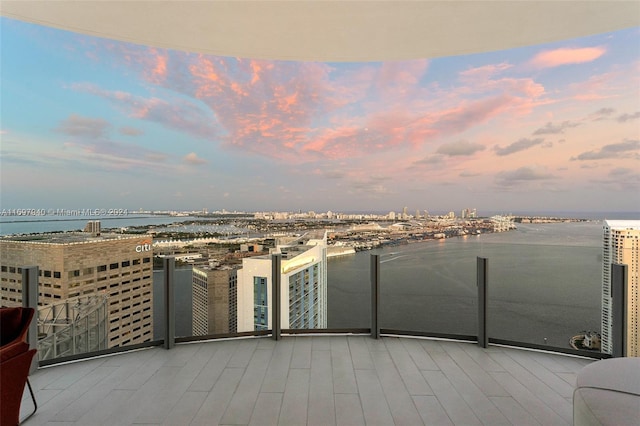 balcony at dusk with a water view