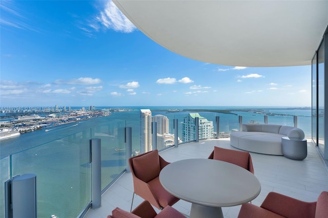 balcony featuring a water view