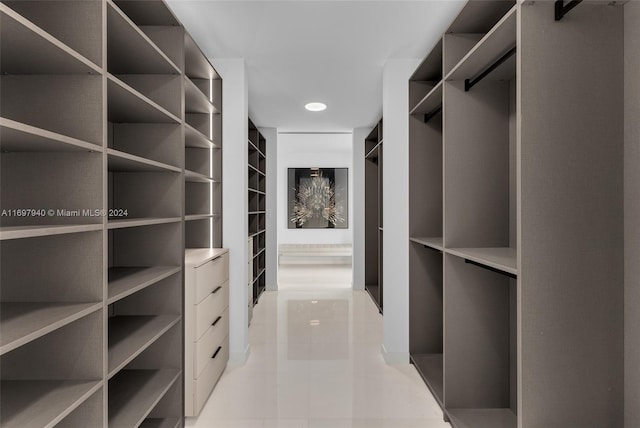 walk in closet featuring light tile patterned floors