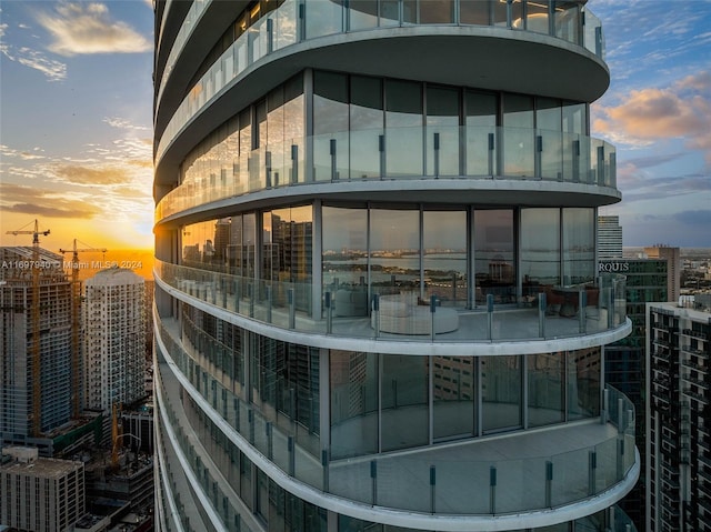 view of outdoor building at dusk