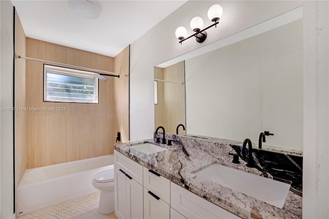 full bathroom featuring tile patterned flooring, vanity, toilet, and tiled shower / bath