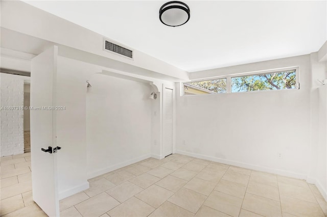 empty room with light tile patterned flooring