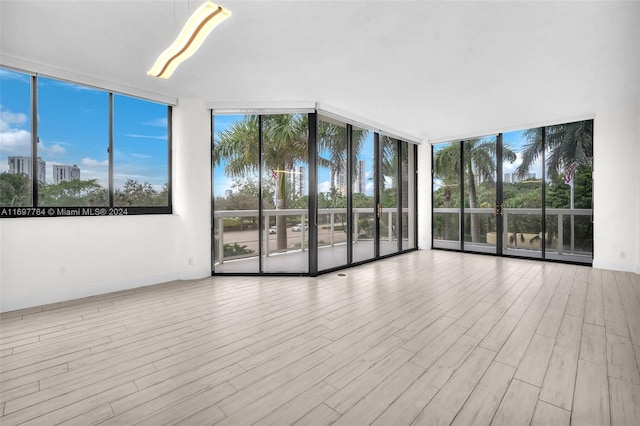 unfurnished sunroom with a wealth of natural light