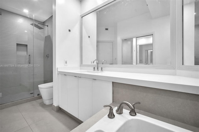 bathroom featuring tile patterned floors, vanity, an enclosed shower, and toilet