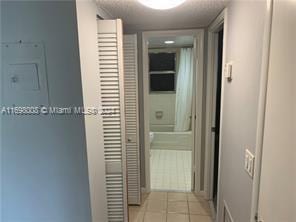 430 SE 2nd Ave Unit 3, Deerfield Beach, FL 33441 - hallway featuring light tile patterned floors