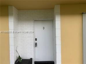 430 SE 2nd Ave Unit 3, Deerfield Beach, FL 33441 - view of exterior entry with brick siding