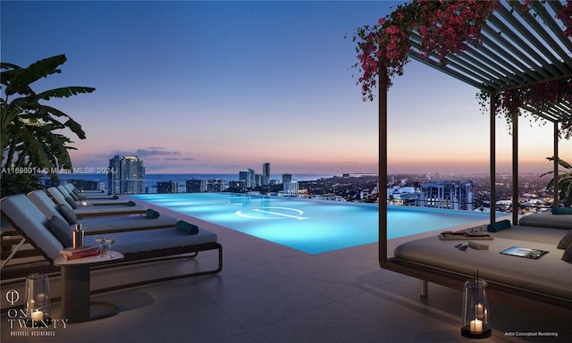 pool at dusk featuring a patio area